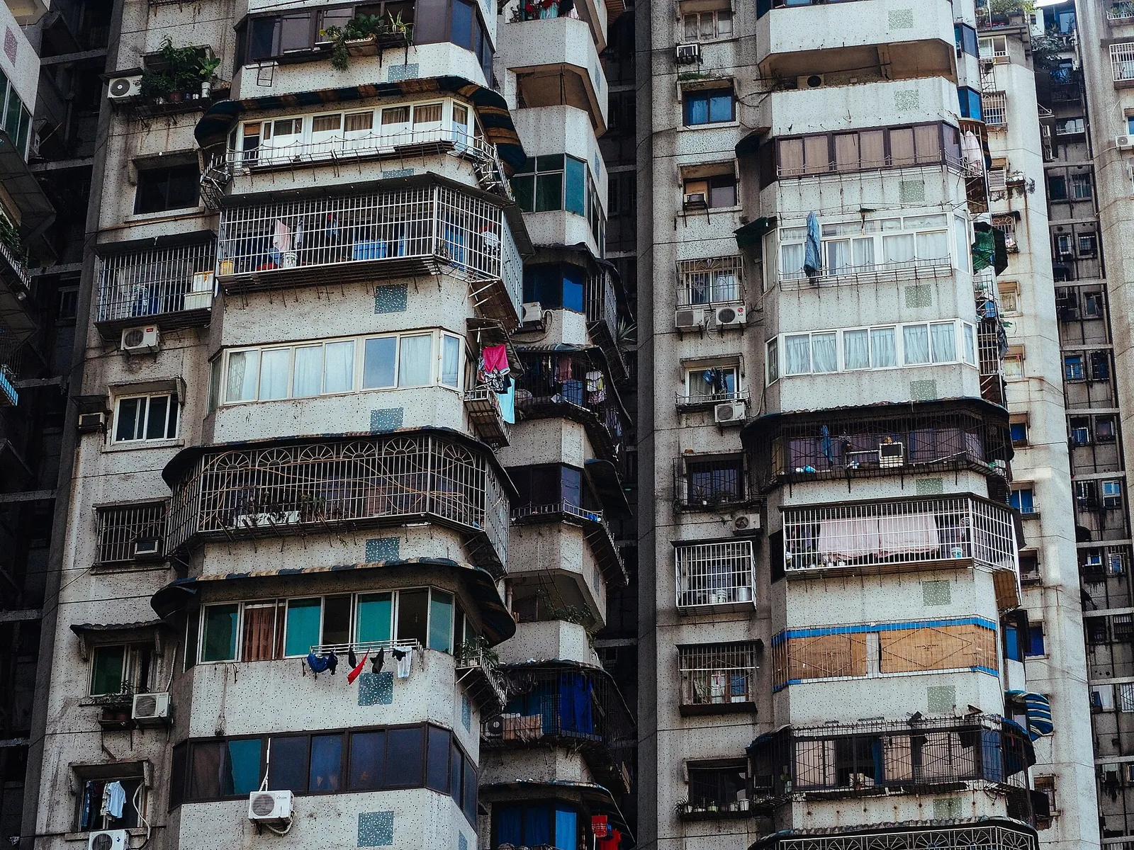 The crowded facades of high-rise apartment blocks in Chongqing.