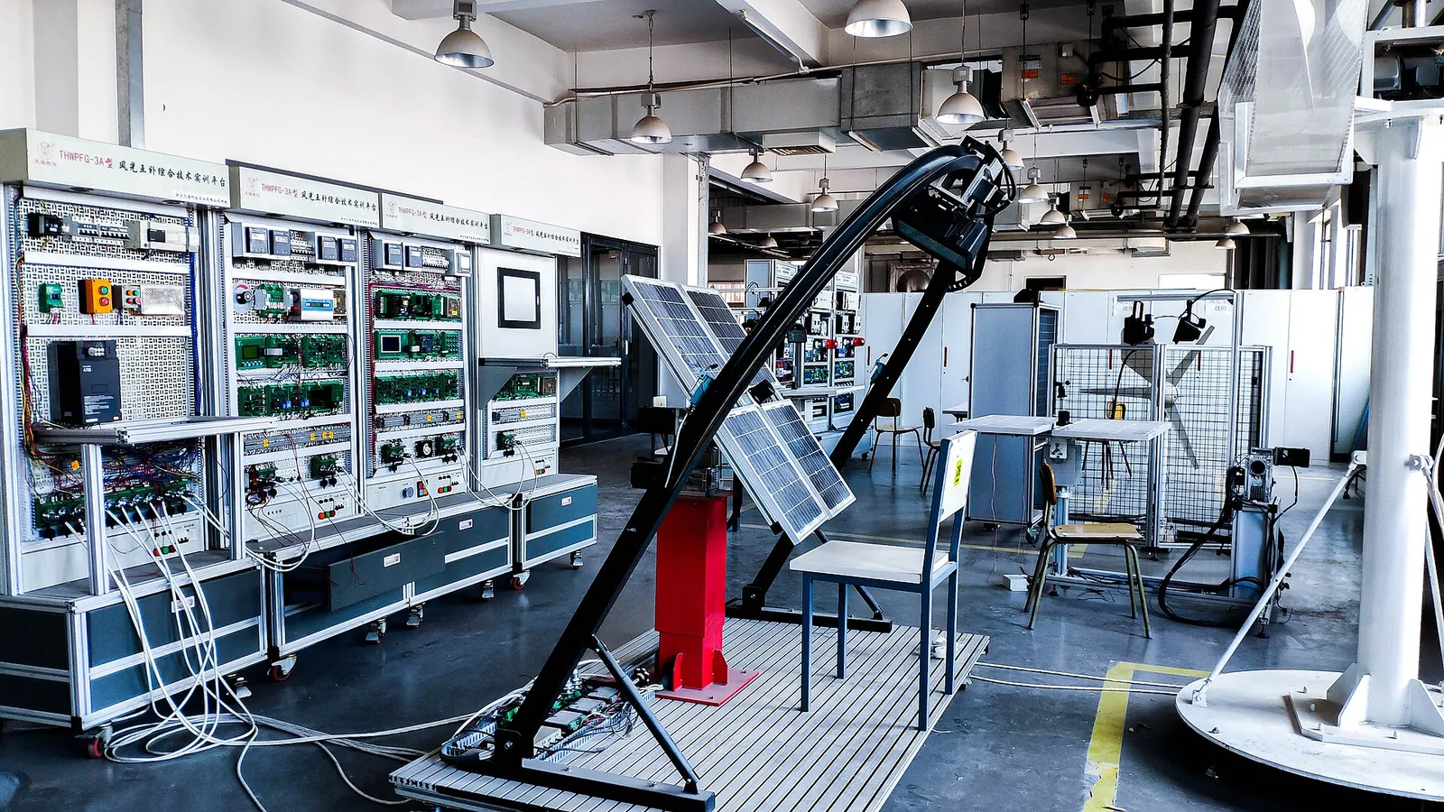 Training panels and equipment in a vocational training workshop at a university of applied sciences in Tianjin.